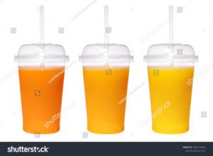 Three clear plastic cups containing different variations of orange juice for sensory testing.