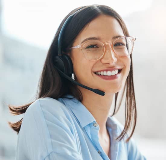 Friendly customer service agent wearing a headset.